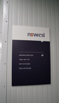 Newrest Group rectangular sign